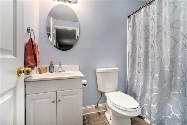 bathroom featuring vanity, toilet, tile patterned floors, baseboards, and a shower with curtain