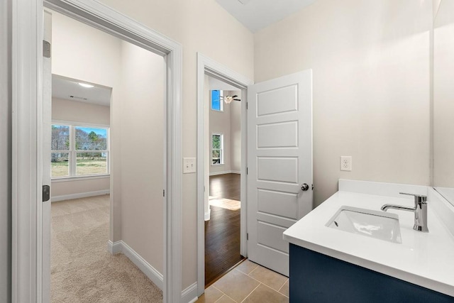 bathroom with tile patterned flooring and vanity