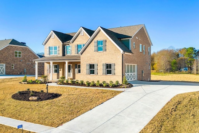 view of front of house featuring a garage and a front lawn