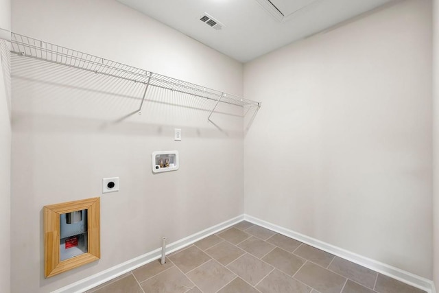 laundry area with electric dryer hookup, washer hookup, and tile patterned flooring