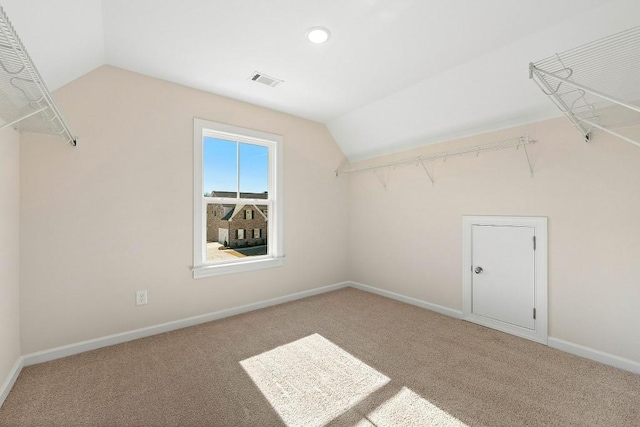 spacious closet with carpet flooring and lofted ceiling