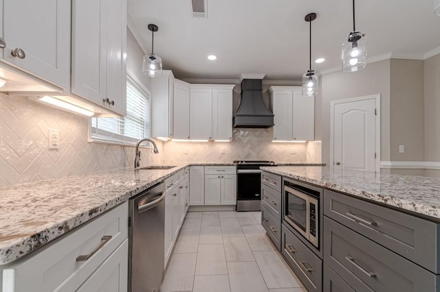 kitchen with premium range hood, stainless steel appliances, and white cabinetry