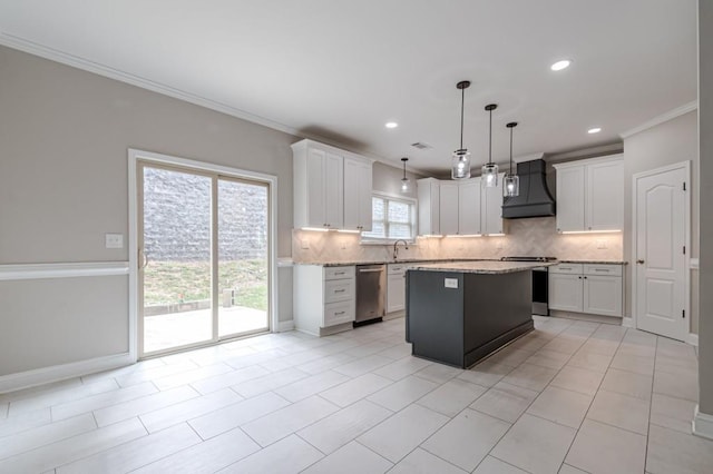 kitchen featuring custom range hood, white cabinetry, pendant lighting, and stainless steel appliances