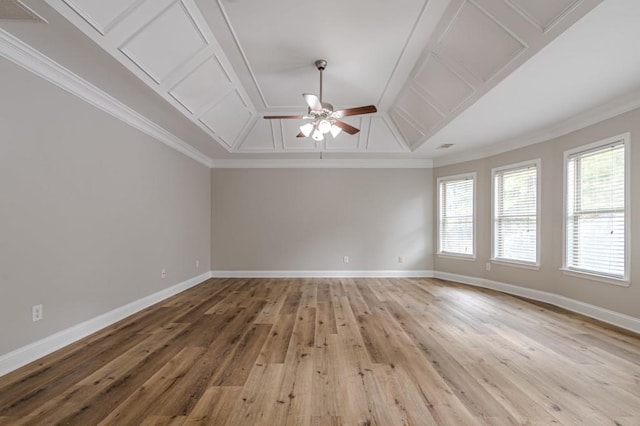 spare room featuring ceiling fan, light wood-type flooring, and ornamental molding