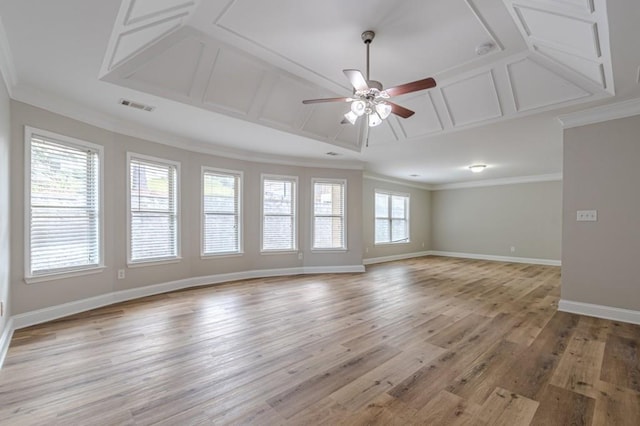 unfurnished living room with ceiling fan, ornamental molding, and light hardwood / wood-style floors