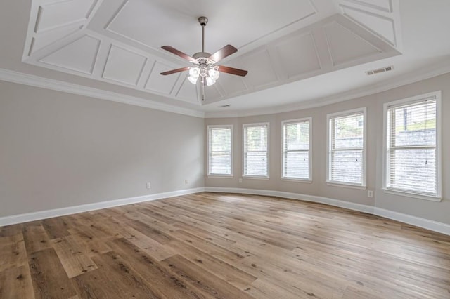 spare room featuring ceiling fan, crown molding, and light hardwood / wood-style floors