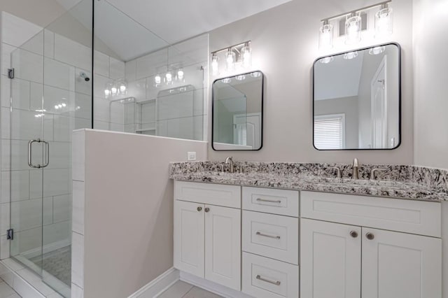 bathroom featuring vanity, lofted ceiling, and a shower with door