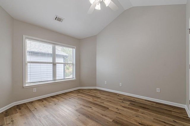 unfurnished room featuring wood-type flooring, lofted ceiling, and ceiling fan