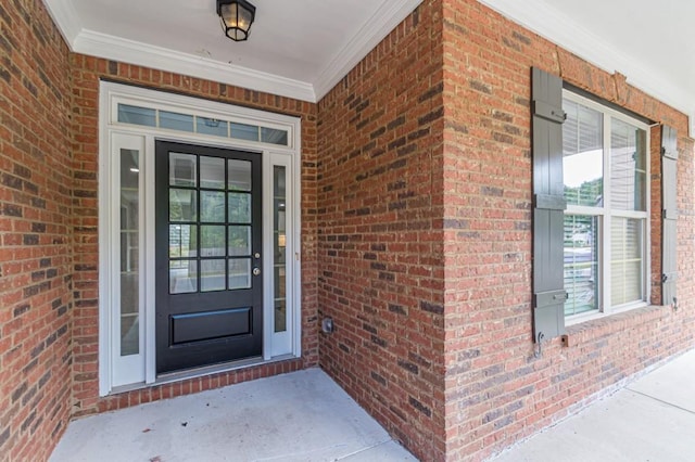 view of exterior entry featuring a porch