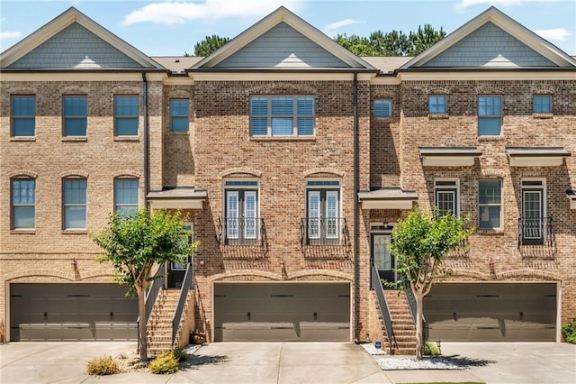 1547 Cambridge Pl, Marietta, GA 30062 - multi unit property featuring concrete driveway, a garage, and brick siding