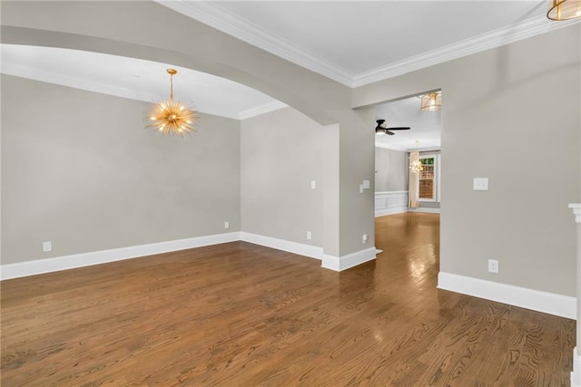 1547 Cambridge Pl, Marietta, GA 30062 - unfurnished room with ornamental molding, wood finished floors, baseboards, a ceiling fan, and arched walkways