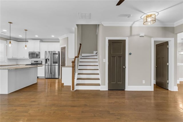 1547 Cambridge Pl, Marietta, GA 30062 - kitchen with appliances with stainless steel finishes, ornamental molding, recessed lighting, white cabinetry, and baseboards