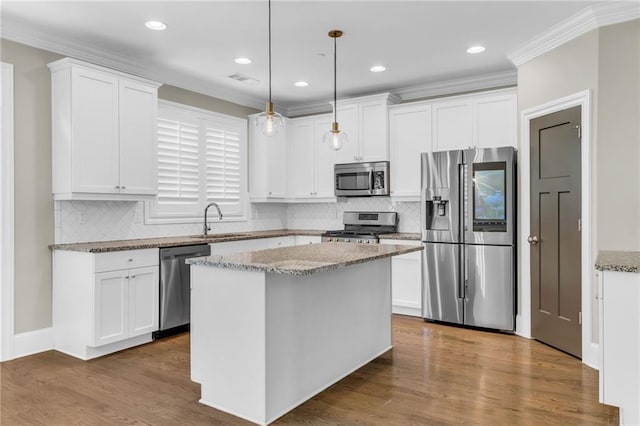 1547 Cambridge Pl, Marietta, GA 30062 - kitchen featuring stainless steel appliances, white cabinets, crown molding, and recessed lighting