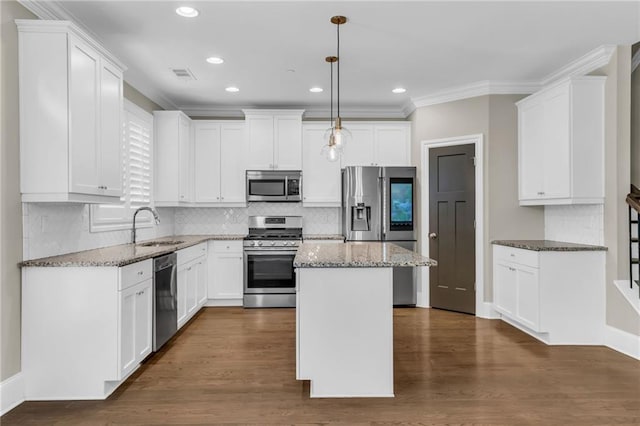 1547 Cambridge Pl, Marietta, GA 30062 - kitchen with appliances with stainless steel finishes, a sink, white cabinets, recessed lighting, and crown molding