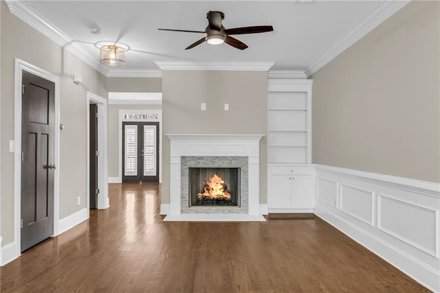 1547 Cambridge Pl, Marietta, GA 30062 - unfurnished living room featuring ceiling fan, ornamental molding, dark wood-type flooring, a premium fireplace, and french doors