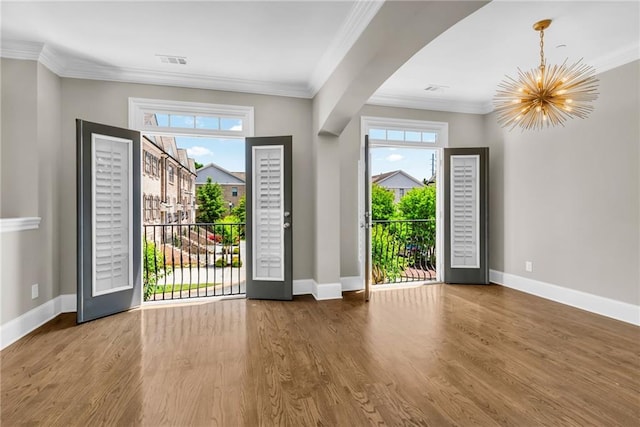 1547 Cambridge Pl, Marietta, GA 30062 - foyer featuring a chandelier, baseboards, wood finished floors, and ornamental molding