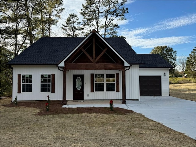 view of front of house with covered porch and a garage