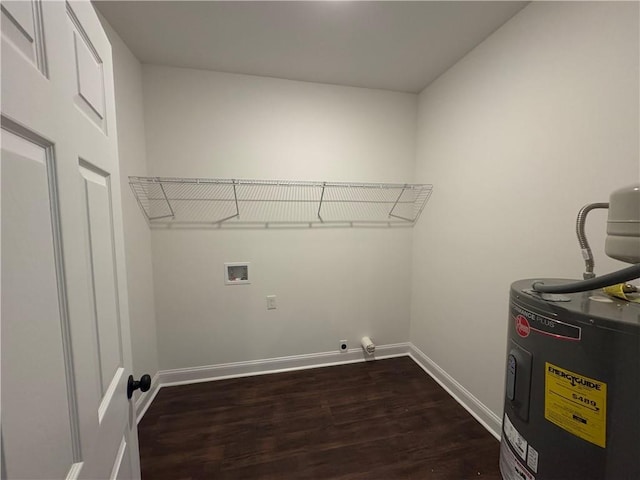 laundry area with dark hardwood / wood-style floors, electric water heater, and hookup for a washing machine