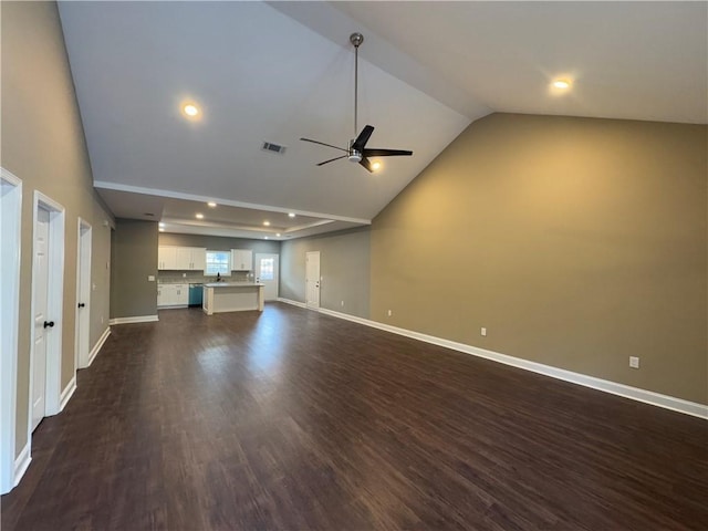 view of side of property featuring a lawn, a patio area, and a garage