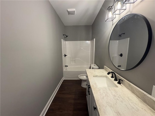 bathroom featuring hardwood / wood-style floors, vanity, and toilet