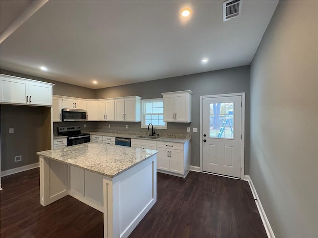 unfurnished living room with dark hardwood / wood-style floors and ceiling fan