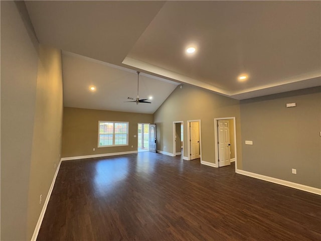 spare room featuring dark hardwood / wood-style flooring, ceiling fan, and a healthy amount of sunlight