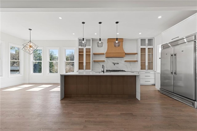 1857 Defoor Ave, Atlanta, GA 30318 - kitchen with open shelves, dark wood-style flooring, built in fridge, and white cabinets