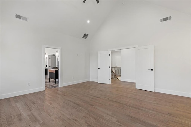 1857 Defoor Ave, Atlanta, GA 30318 - unfurnished bedroom with high vaulted ceiling, baseboards, and visible vents