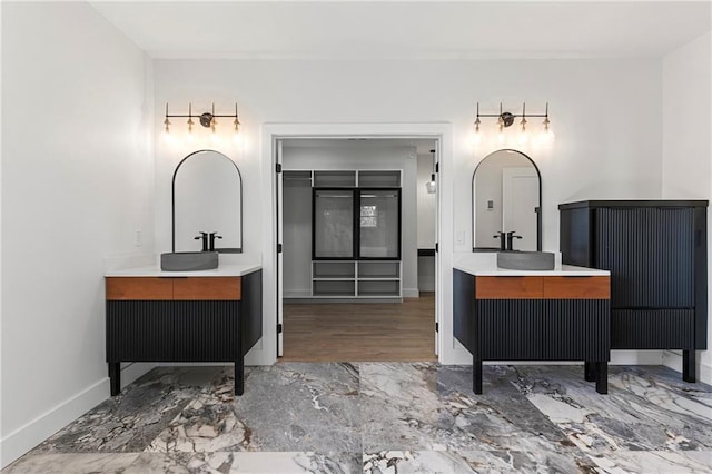1857 Defoor Ave, Atlanta, GA 30318 - full bathroom with baseboards, two vanities, and marble finish floor