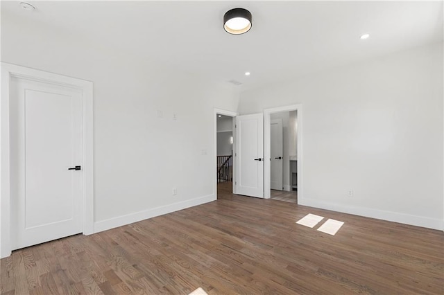 1857 Defoor Ave, Atlanta, GA 30318 - unfurnished bedroom featuring recessed lighting, baseboards, and wood finished floors