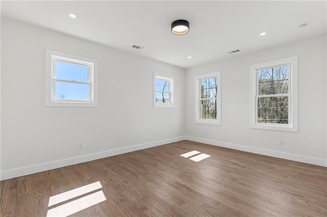 1857 Defoor Ave, Atlanta, GA 30318 - empty room with baseboards, recessed lighting, wood finished floors, and visible vents