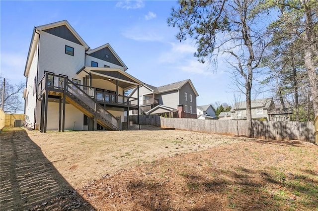 1857 Defoor Ave, Atlanta, GA 30318 - rear view of house with board and batten siding, a deck, a residential view, a fenced backyard, and stairs