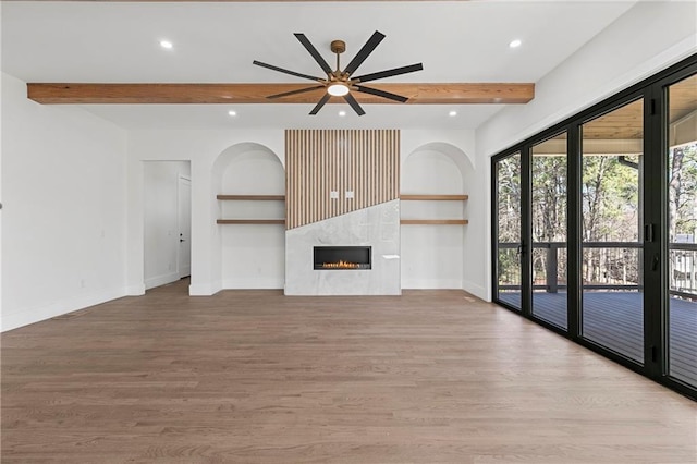 1857 Defoor Ave, Atlanta, GA 30318 - unfurnished living room with baseboards, recessed lighting, beam ceiling, and wood finished floors