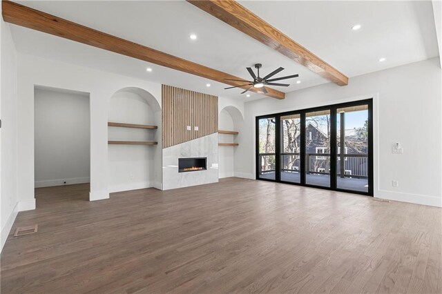 1857 Defoor Ave, Atlanta, GA 30318 - unfurnished living room with baseboards, ceiling fan, a fireplace, and wood finished floors