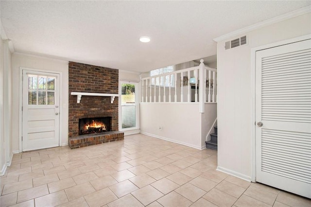 unfurnished living room with visible vents, ornamental molding, light tile patterned flooring, and stairway