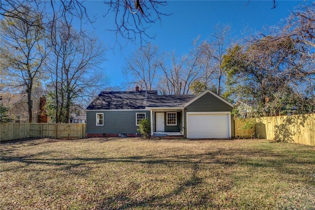 view of front of home with a garage and a front yard