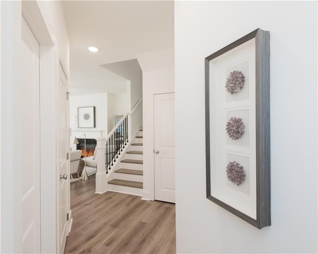 hall with light hardwood / wood-style flooring