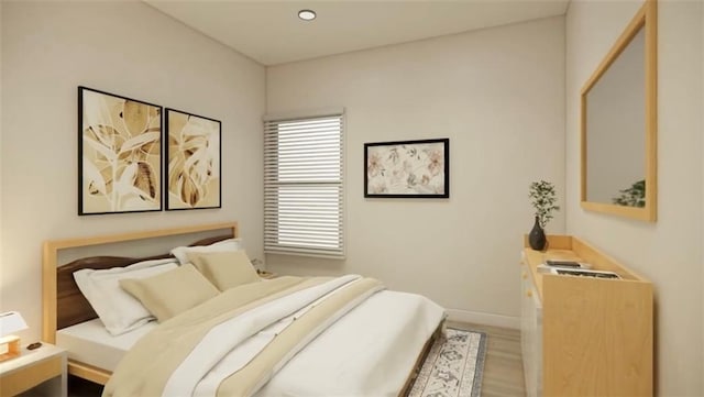 bedroom with recessed lighting, light wood-style flooring, and baseboards
