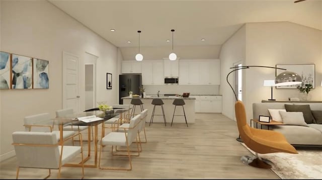dining space featuring baseboards, recessed lighting, and light wood-style flooring