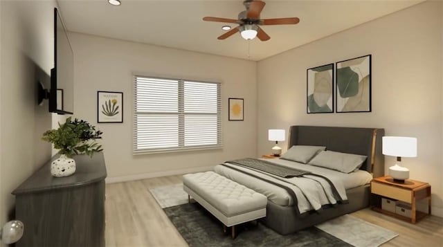 bedroom featuring light wood-type flooring, a ceiling fan, and baseboards