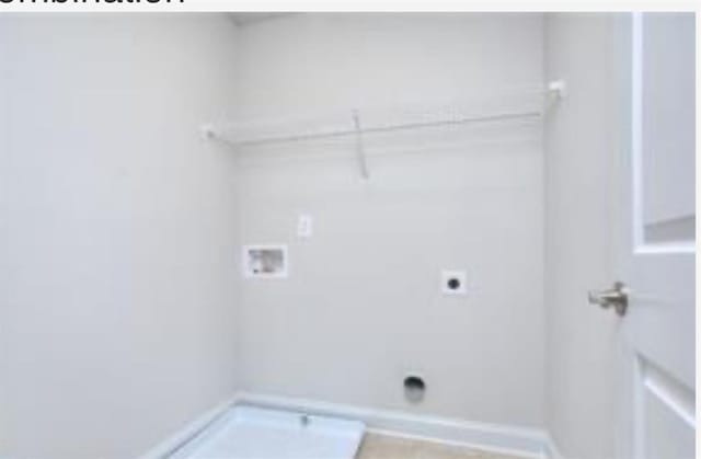 laundry area featuring electric dryer hookup, hookup for a washing machine, and laundry area