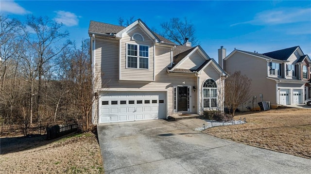 front facade featuring a front yard and a garage