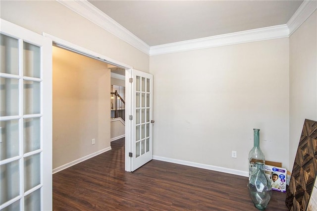 unfurnished room with ornamental molding, french doors, and dark hardwood / wood-style floors