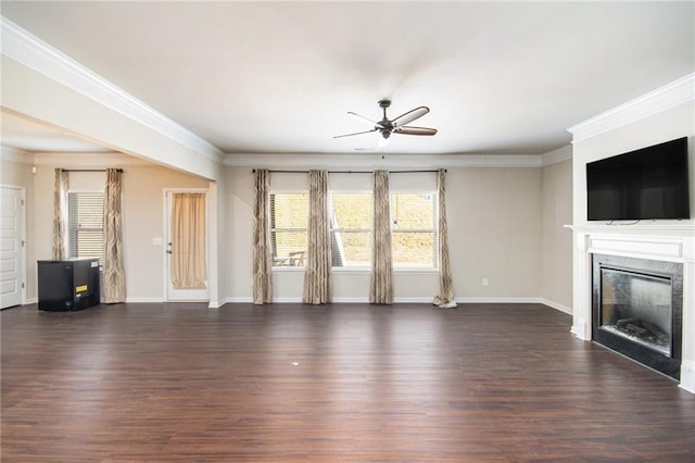 unfurnished living room with dark hardwood / wood-style flooring, ceiling fan, and crown molding