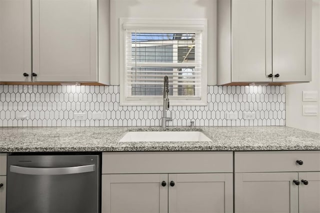 372 Garnet Dr, Acworth, GA 30101 - kitchen with dishwasher, a sink, decorative backsplash, and light stone countertops