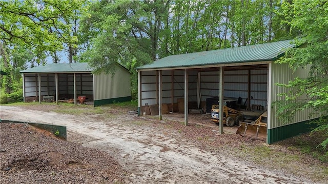 14501 Woolsey Rd, Hampton, GA 30228 - view of pole building with a detached carport and dirt driveway