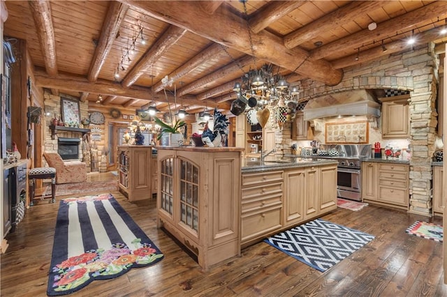 14501 Woolsey Rd, Hampton, GA 30228 - kitchen featuring high end stove, a wooden ceiling with exposed beams, cream cabinetry, dark wood-type flooring, and glass insert cabinets
