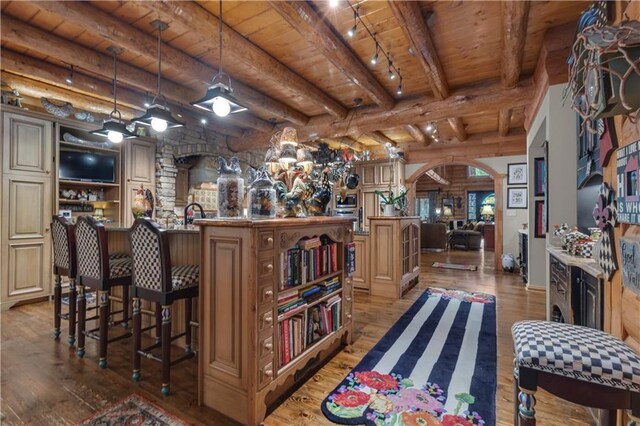 14501 Woolsey Rd, Hampton, GA 30228 - indoor bar featuring hardwood / wood-style flooring, arched walkways, a wood ceiling with exposed beams, and decorative light fixtures