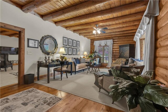 14501 Woolsey Rd, Hampton, GA 30228 - living area featuring a wood ceiling with exposed beams, wood-type flooring, ceiling fan, and rustic walls