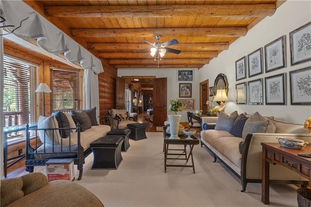 14501 Woolsey Rd, Hampton, GA 30228 - living room with a wooden ceiling with exposed beams, log walls, ceiling fan, and light colored carpet